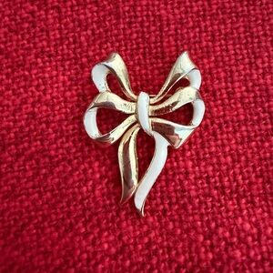 Elegant Gold and White Bow Brooch